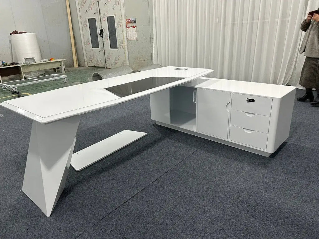 White L-shaped office desk with drawers on the right and a side return