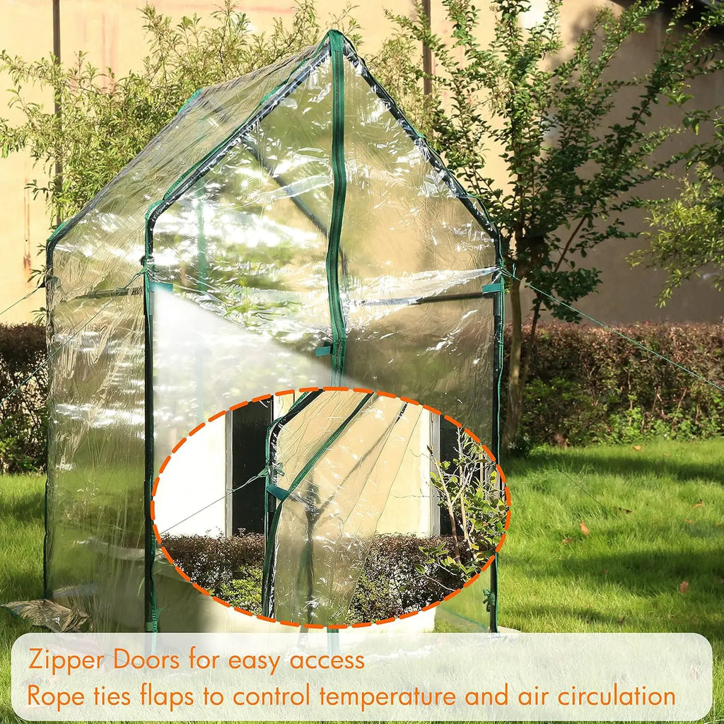 Raised garden bed greenhouse with clear cover, zippered doors, and rope ties for ventilation