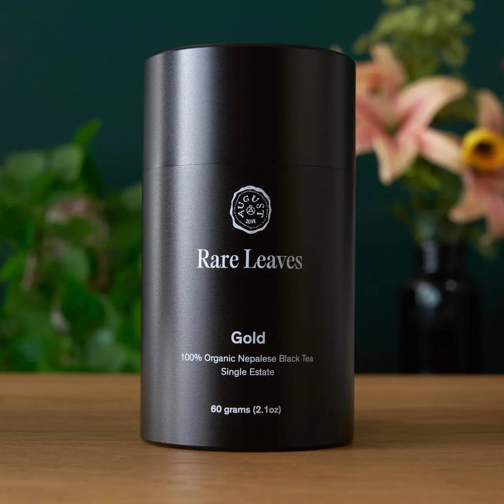 Gold tea canister, dark metal cylinder with Gold roast details and 60 g