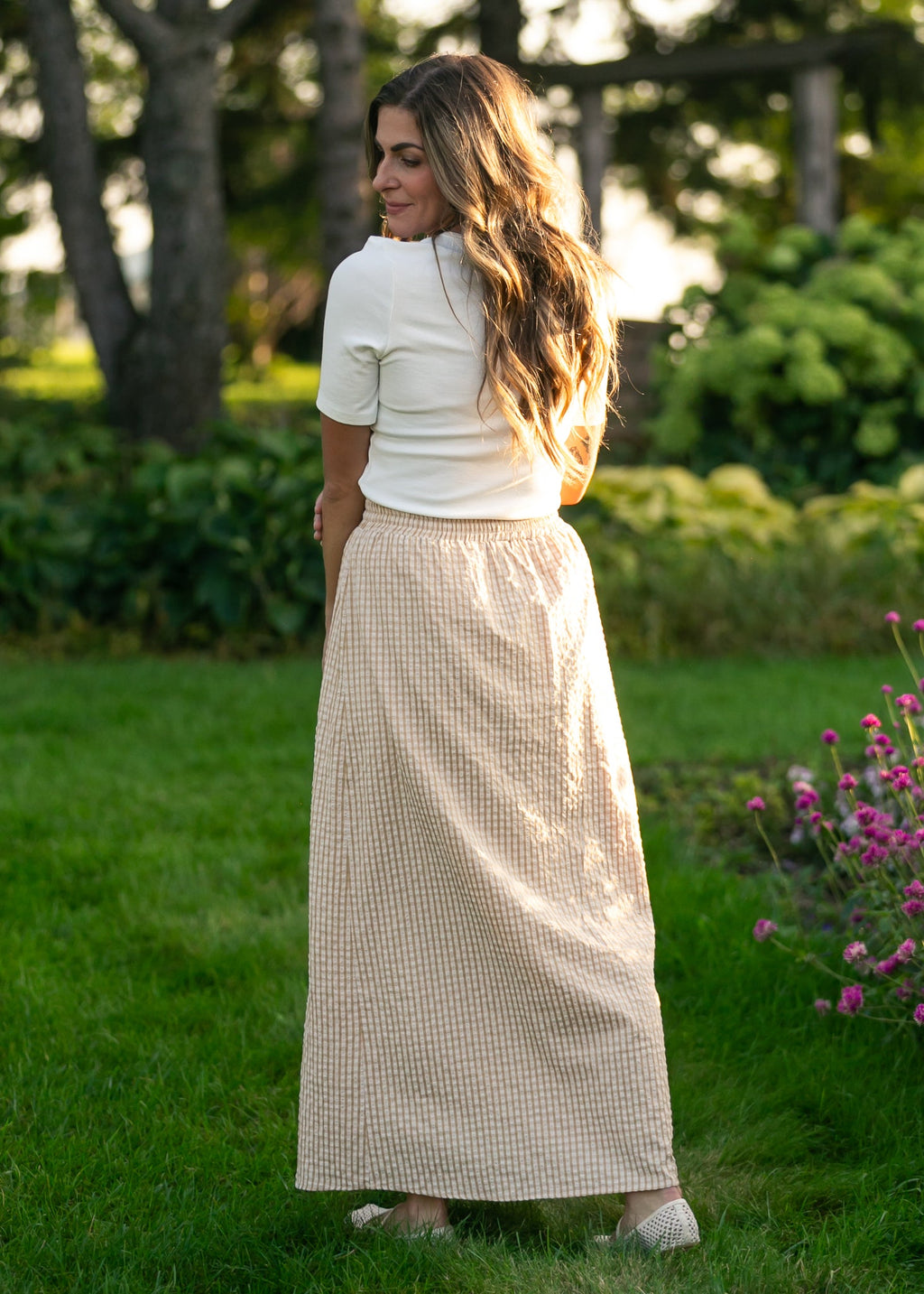 Gingham maxi skirt in light beige and white with elastic waistband and flowing maxi length