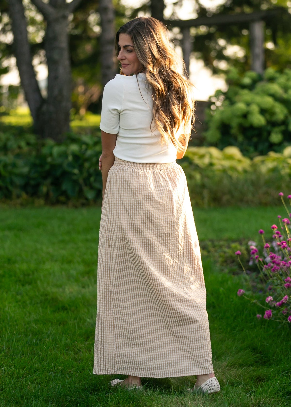 Gingham maxi skirt in light beige and white with elastic waistband and flowing maxi length