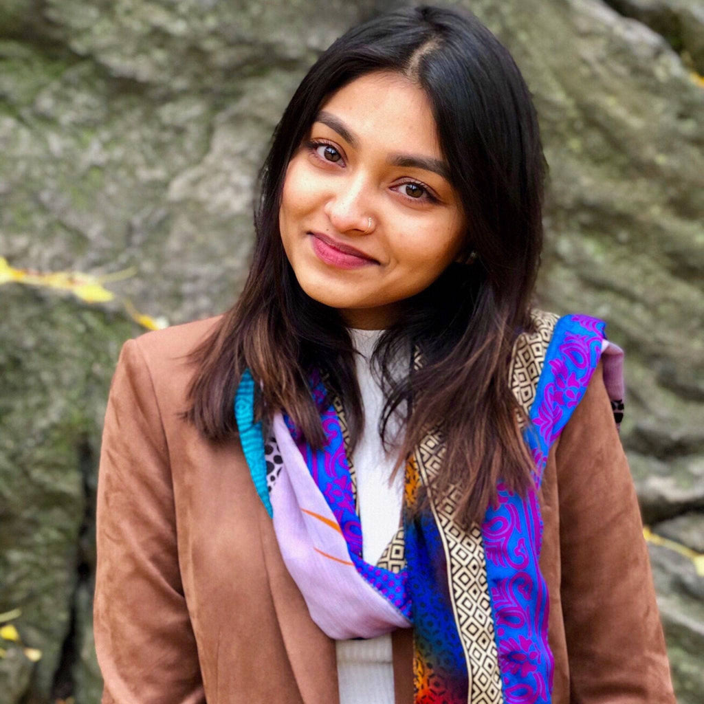 Colorful patchwork scarf in blue and purple with geometric patterns and bold borders