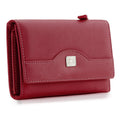Red women’s leather trifold wallet with snap flap and metal logo on front