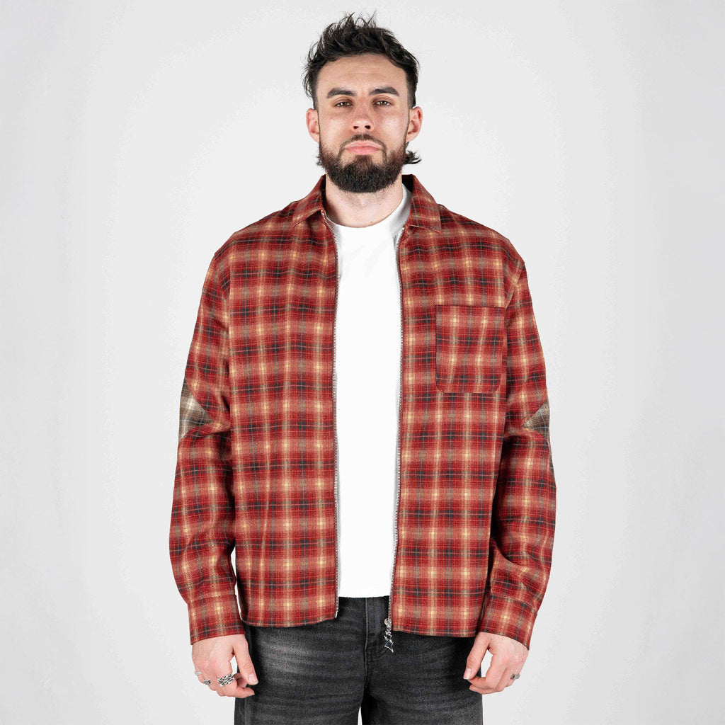 Red plaid zip-up flannel jacket front view, stand collar over dark jeans