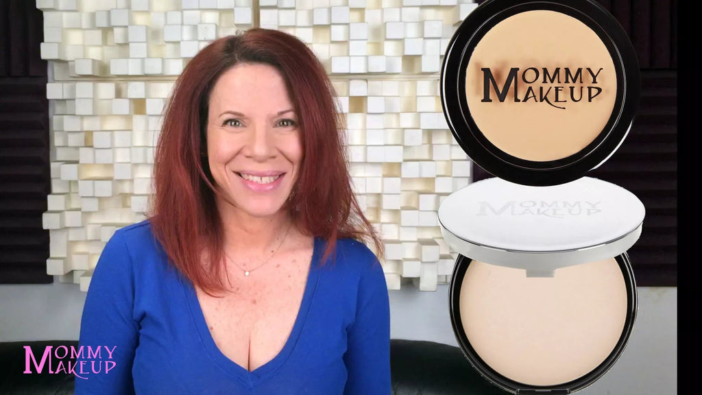 Black concealer compact with beige cream pan and lid