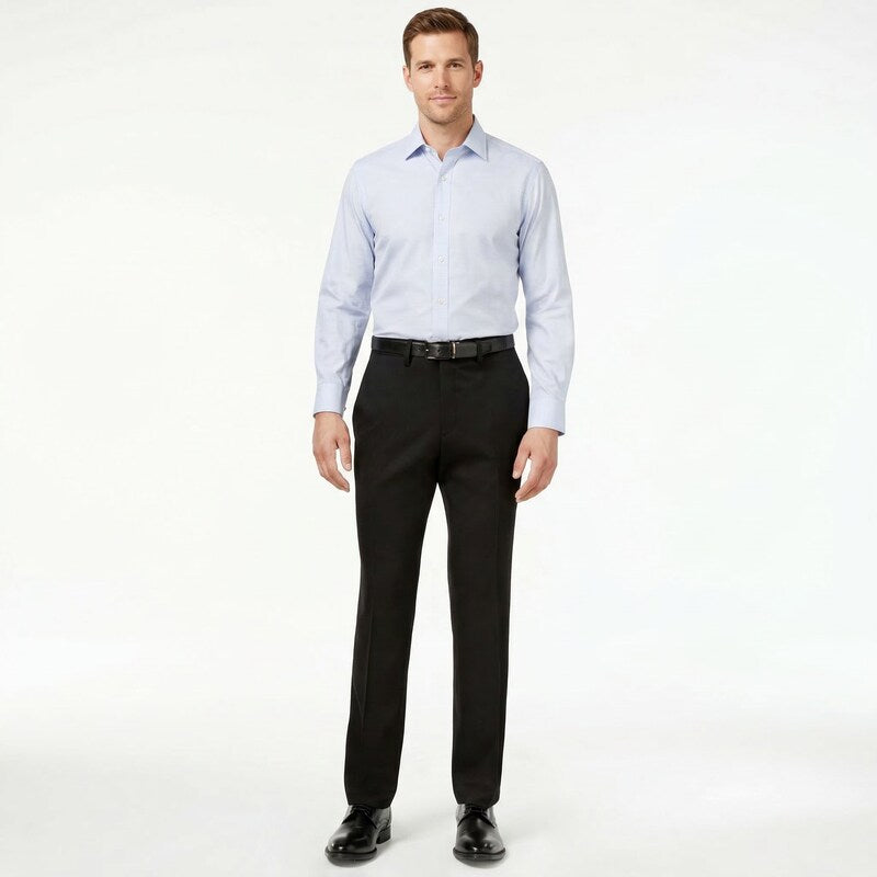 Men's black stretch slim-fit pants, full-body front view with buttoned shirt and belt