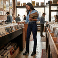 Women's high-rise straight jeans in dark blue denim with front button and belt loops.