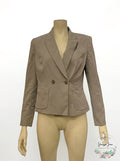 Grey peak-lapel blazer on mannequin, tailored single-breasted with two flap pockets.