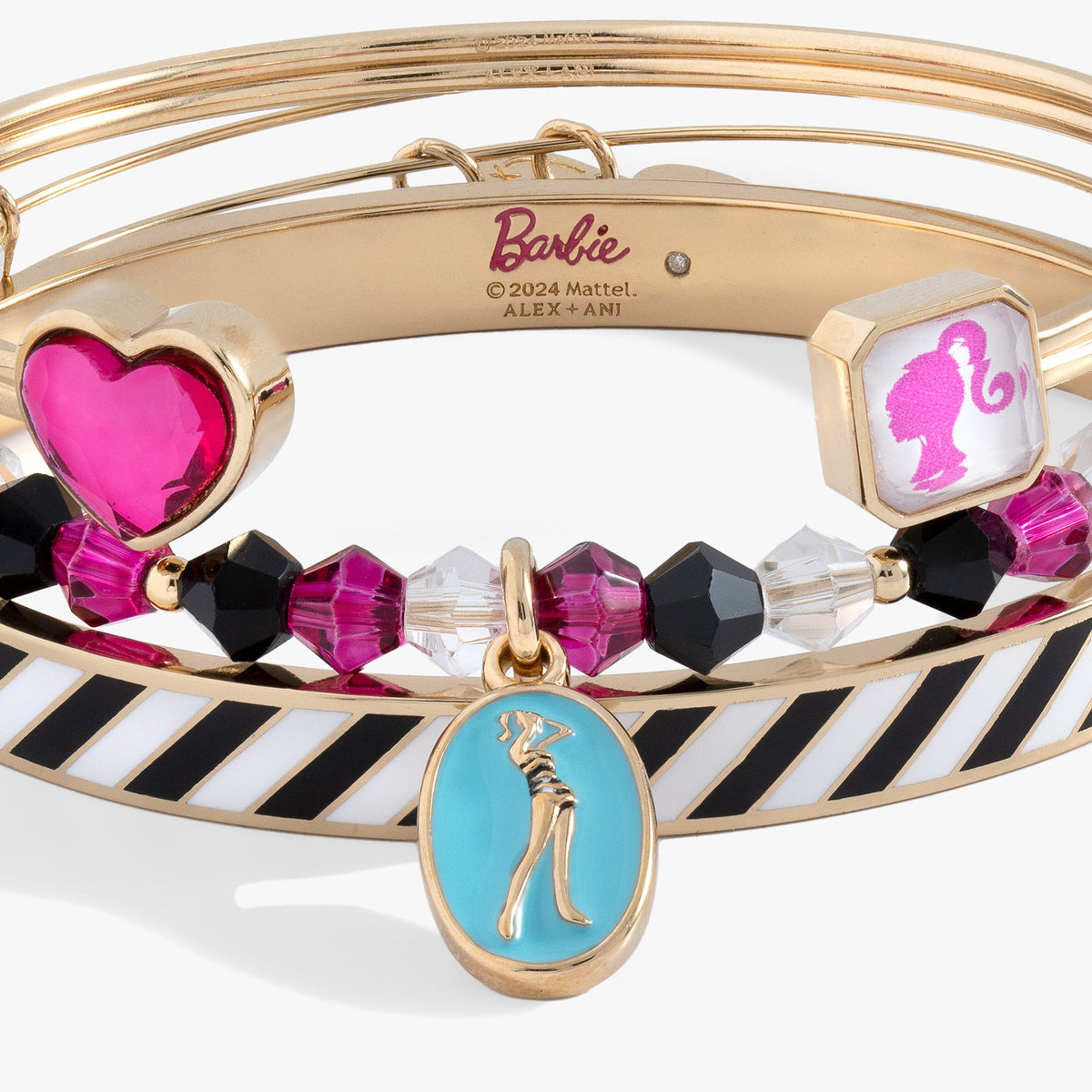Gold tone bangle bracelet with heart and cat charms, pink and black crystal beads