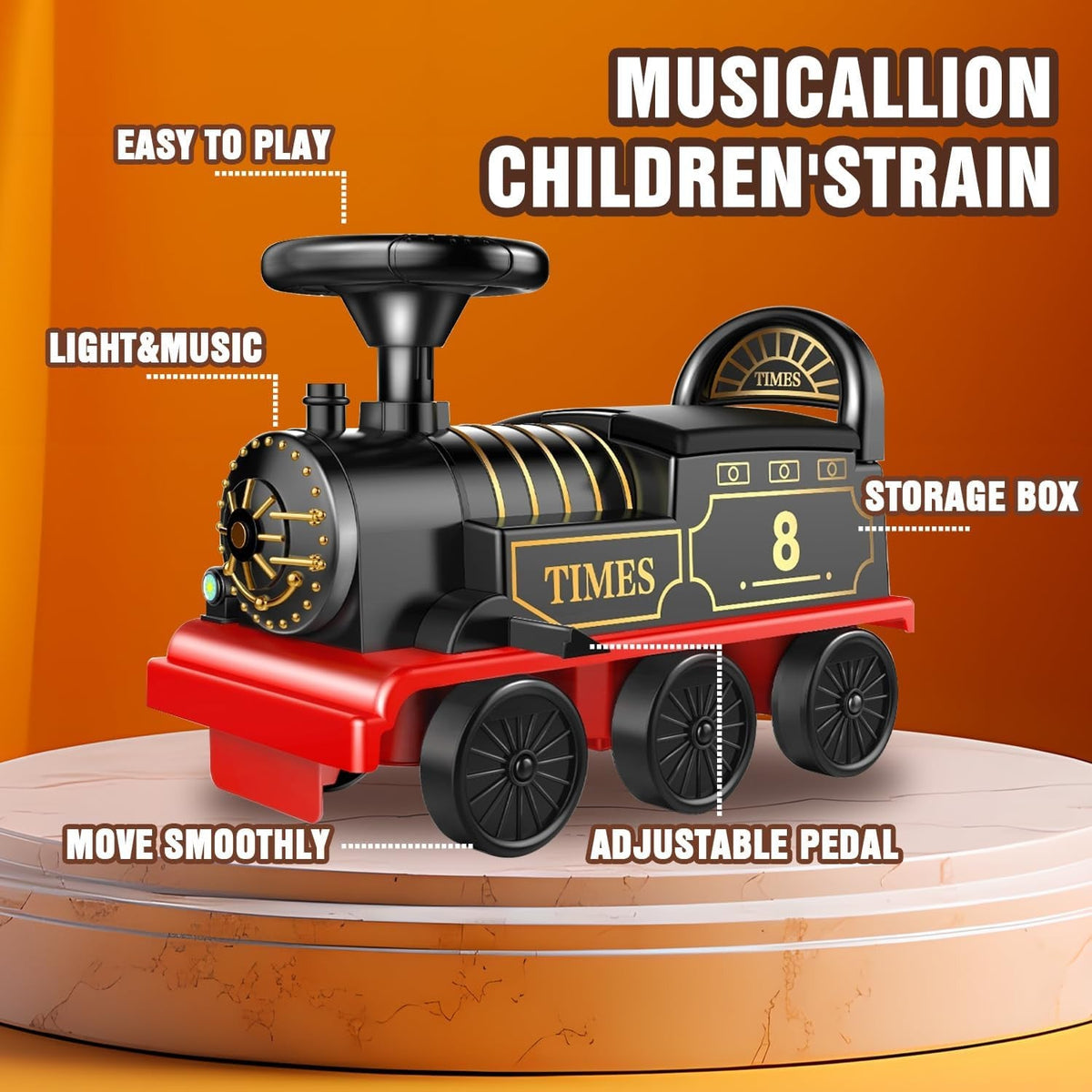 Black and gold electric toy locomotive with red chassis, four wheels, and storage box