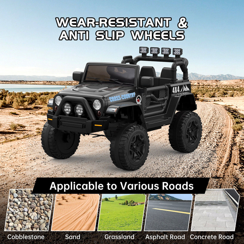 Black ride-on electric truck with wear-resistant anti-slip tread wheels on rough road