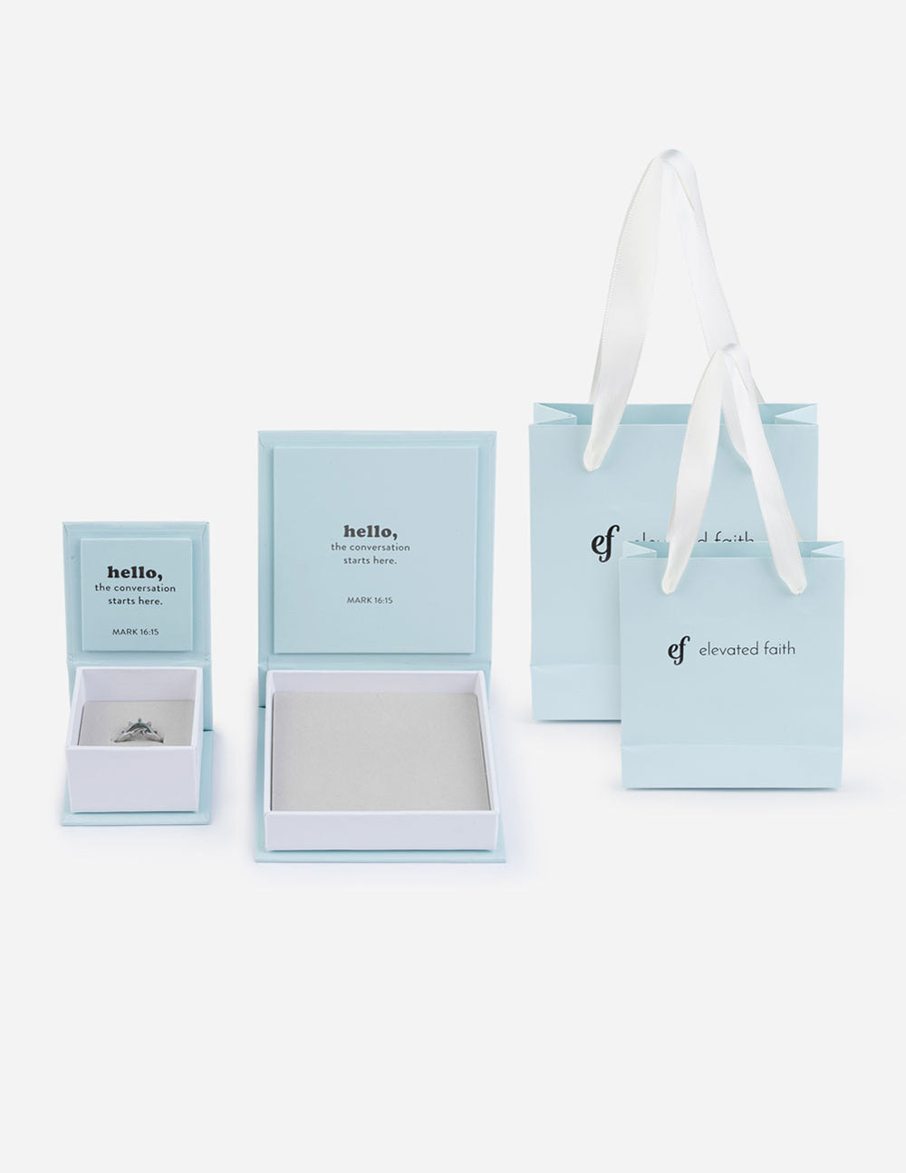 Set of light blue ring gift boxes and matching shopping bag