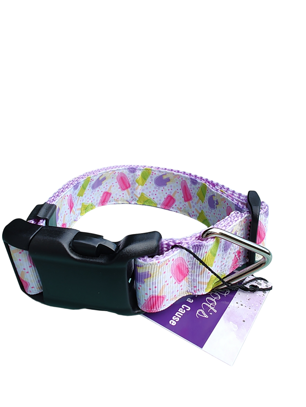 Heart-pattern dog collar on black hardware with metal D-ring and tag