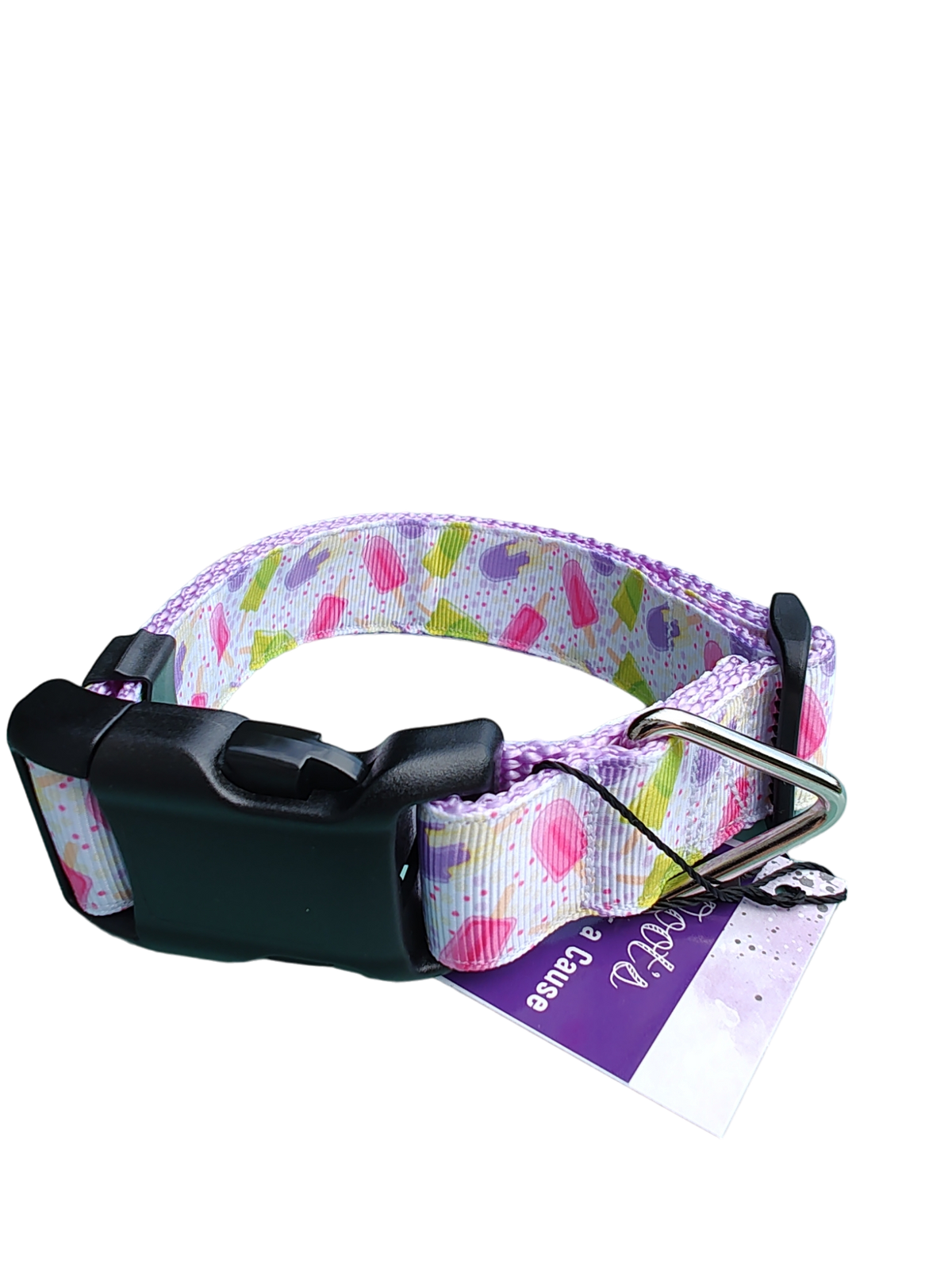 Heart-pattern dog collar on black hardware with metal D-ring and tag