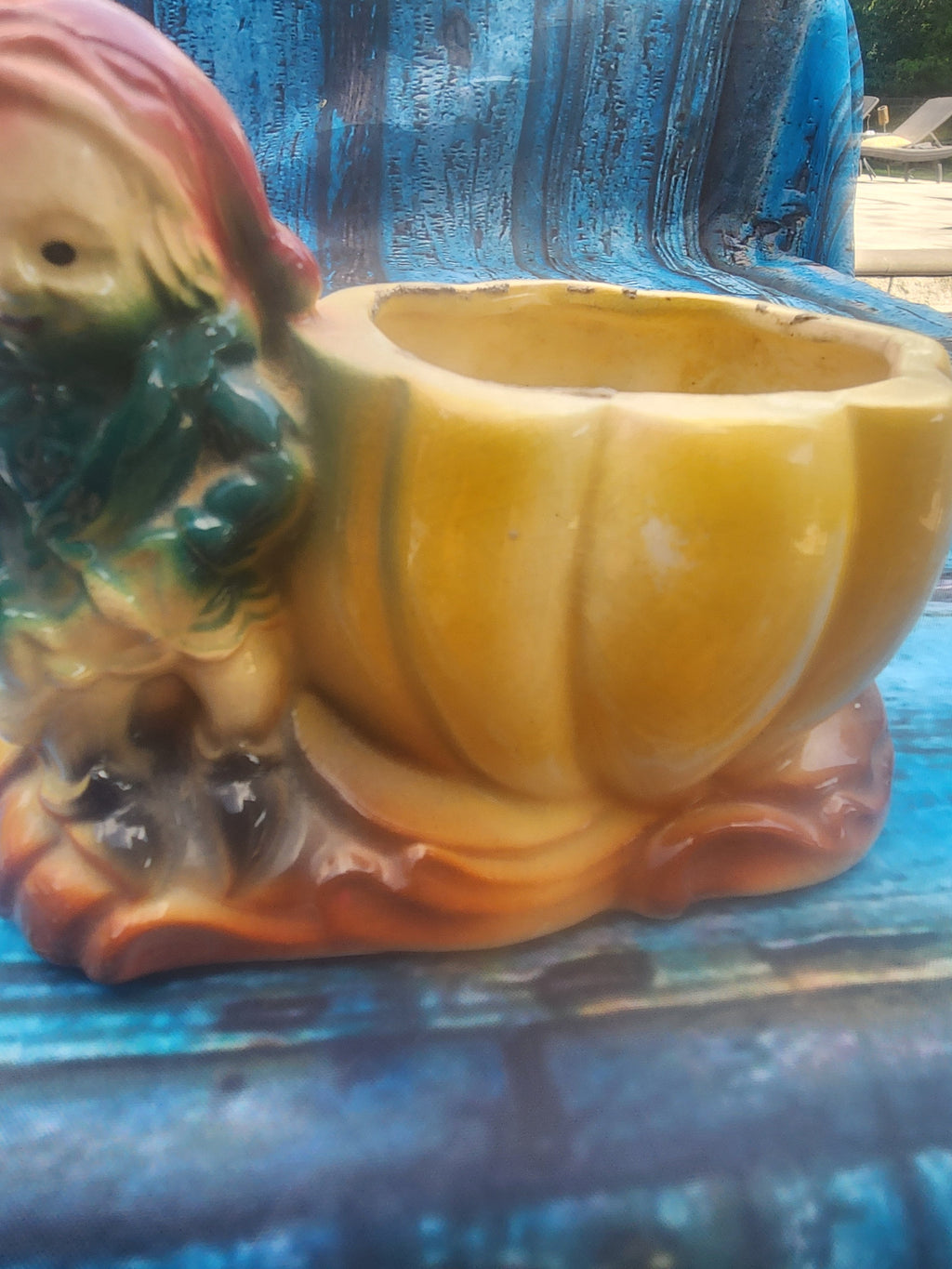 Yellow ceramic gnome pumpkin planter, side view with seated gnome and bowl