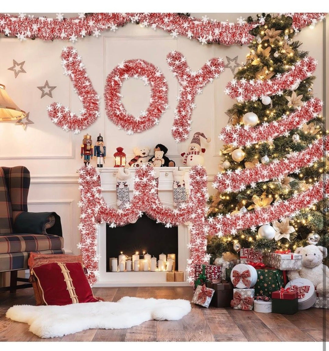Red and white snowflake tinsel garland draped in a looped indoor holiday display