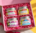 Body butter creme gift set with four body butter jars in an open gift box