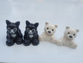 LEGO DUPLO animal figure set: 2 black cats and 2 white polar bears, seated poses
