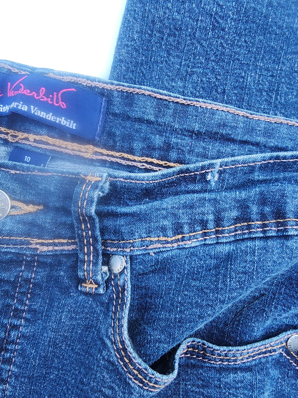 Gloria Vanderbilt jeans waistband label with size 10 and button fly detail