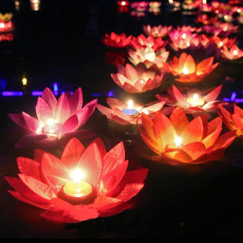 Pink and red lotus-shaped floating LED candles with glowing flame-effect lights