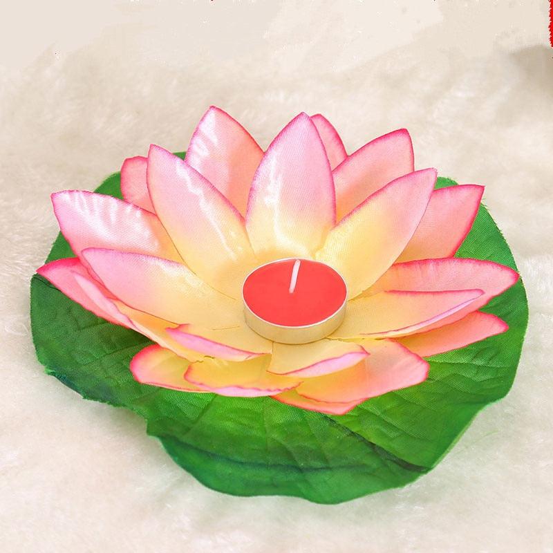 Pink and green lotus-shaped floating LED candle with red center tea-light glow
