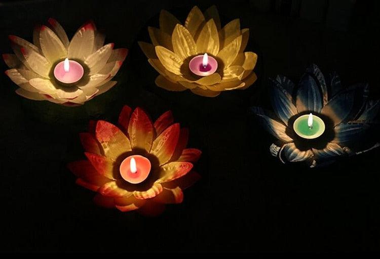Set of lotus-shaped floating LED candles in gold, red, and green glowing colors