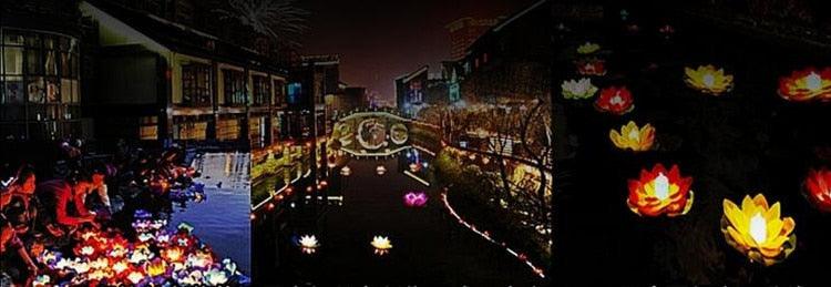 Lotus-shaped floating LED candles lined in a walkway with glowing light clusters