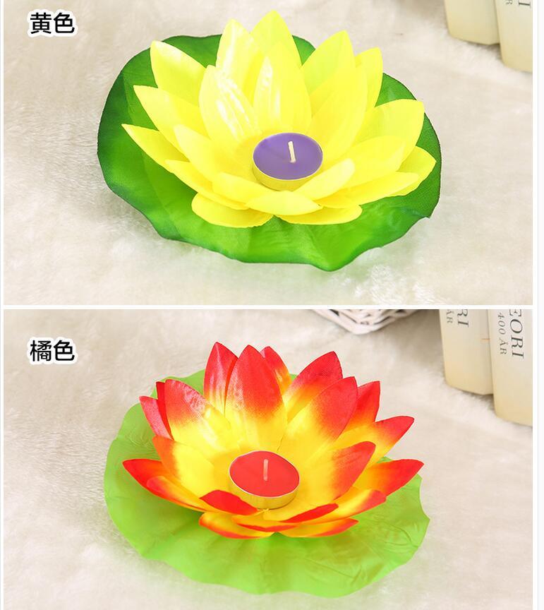 Yellow and orange-red lotus LED floating candles with green bases and lit centers