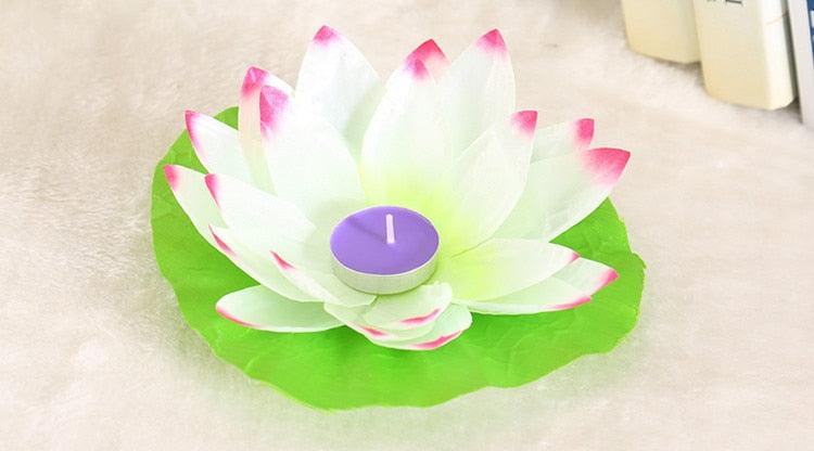 White, purple, and green lotus-shaped floating LED candle with lavender center light