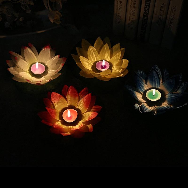 Set of four lotus LED floating candles with colored petals and small central flames