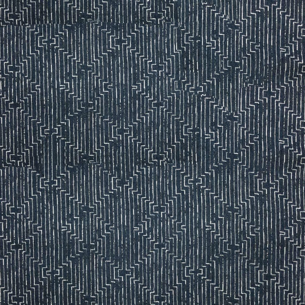 Dark denim fabric with repeating cross-like geometric pattern