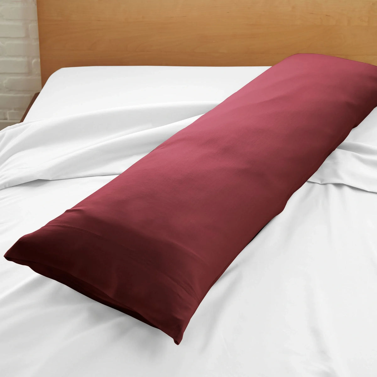 Ruby red body pillowcase close-up on bed