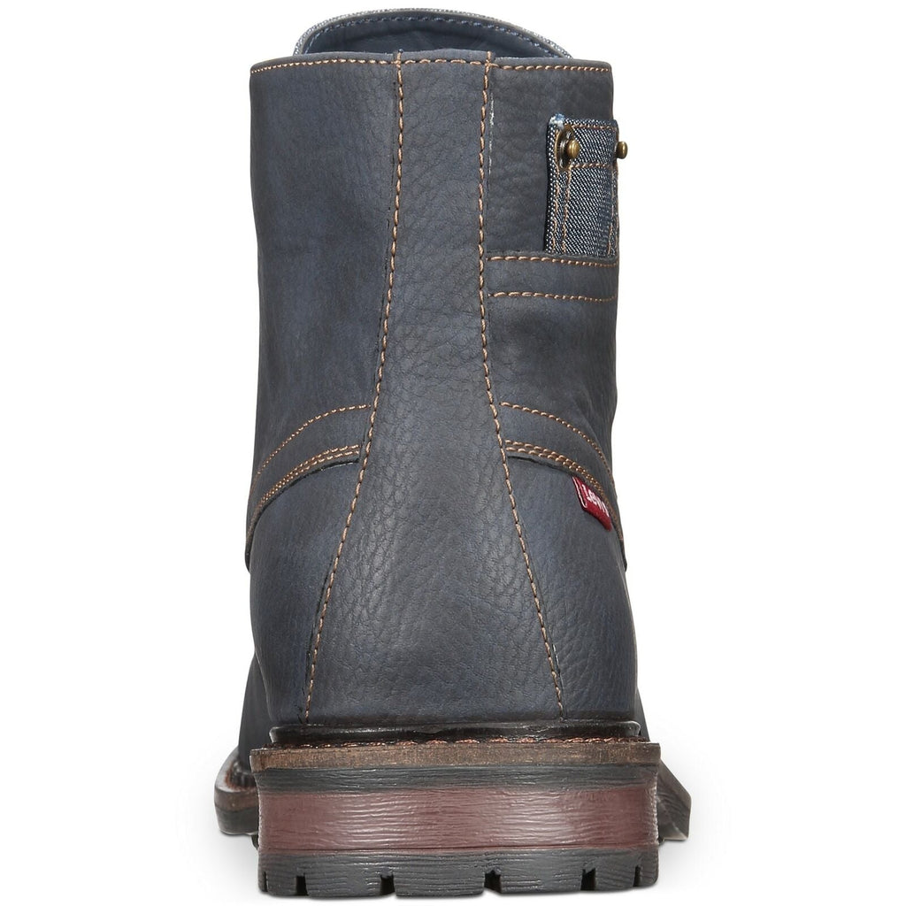 Navy boot back view with vertical stitching panels and padded heel collar