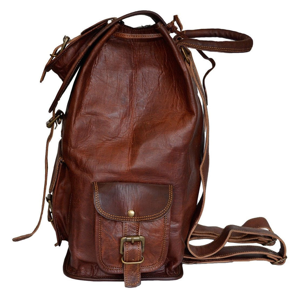 Brown leather drawstring-style hiking backpack with top handle and front pocket