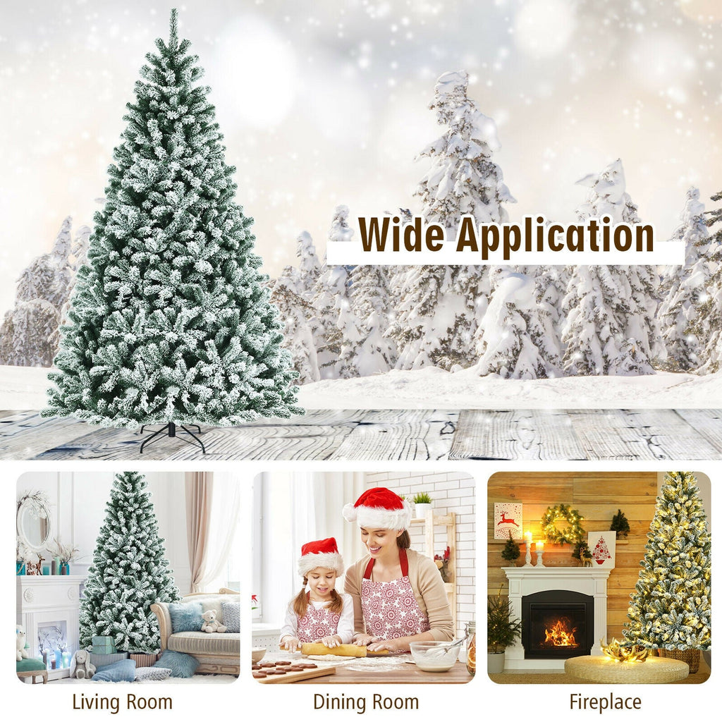 Frosted snow flocked Christmas tree with warm white lights in a winter outdoor setting
