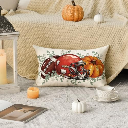 Rectangular fall pillow cover with football helmet and pumpkin print, green foliage border