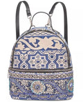 Steve Madden Duchess backpack with two black straps and blue patterned front panel