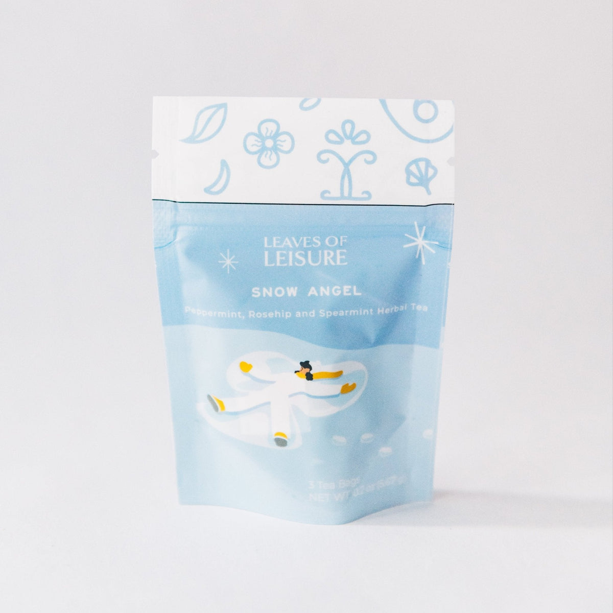 Blue herbal tea pouch with winter illustration and Snow Angel label