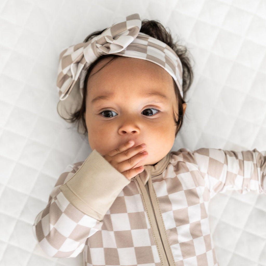 Checkered infant zippy suit with hood and front zipper; beige and white