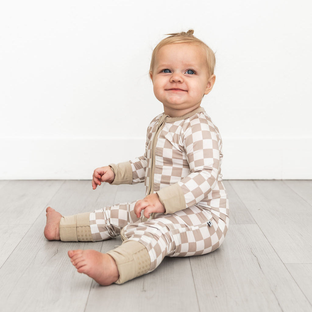 Checkered footed baby zippy suit with front zipper and hood; beige and white
