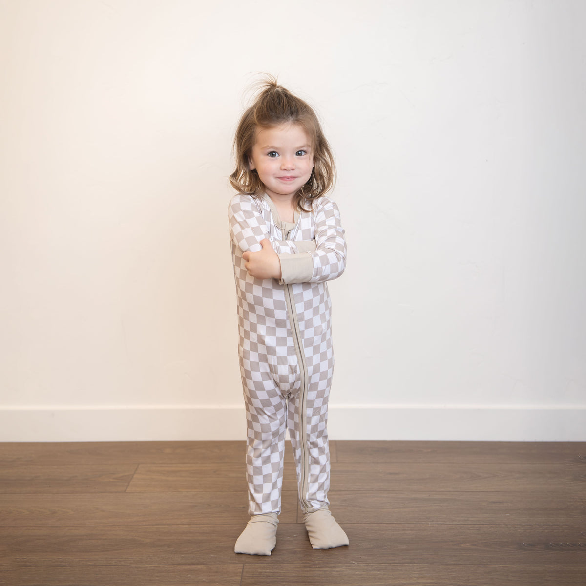 Checkered hooded infant footed zippy suit with front zipper; beige and white
