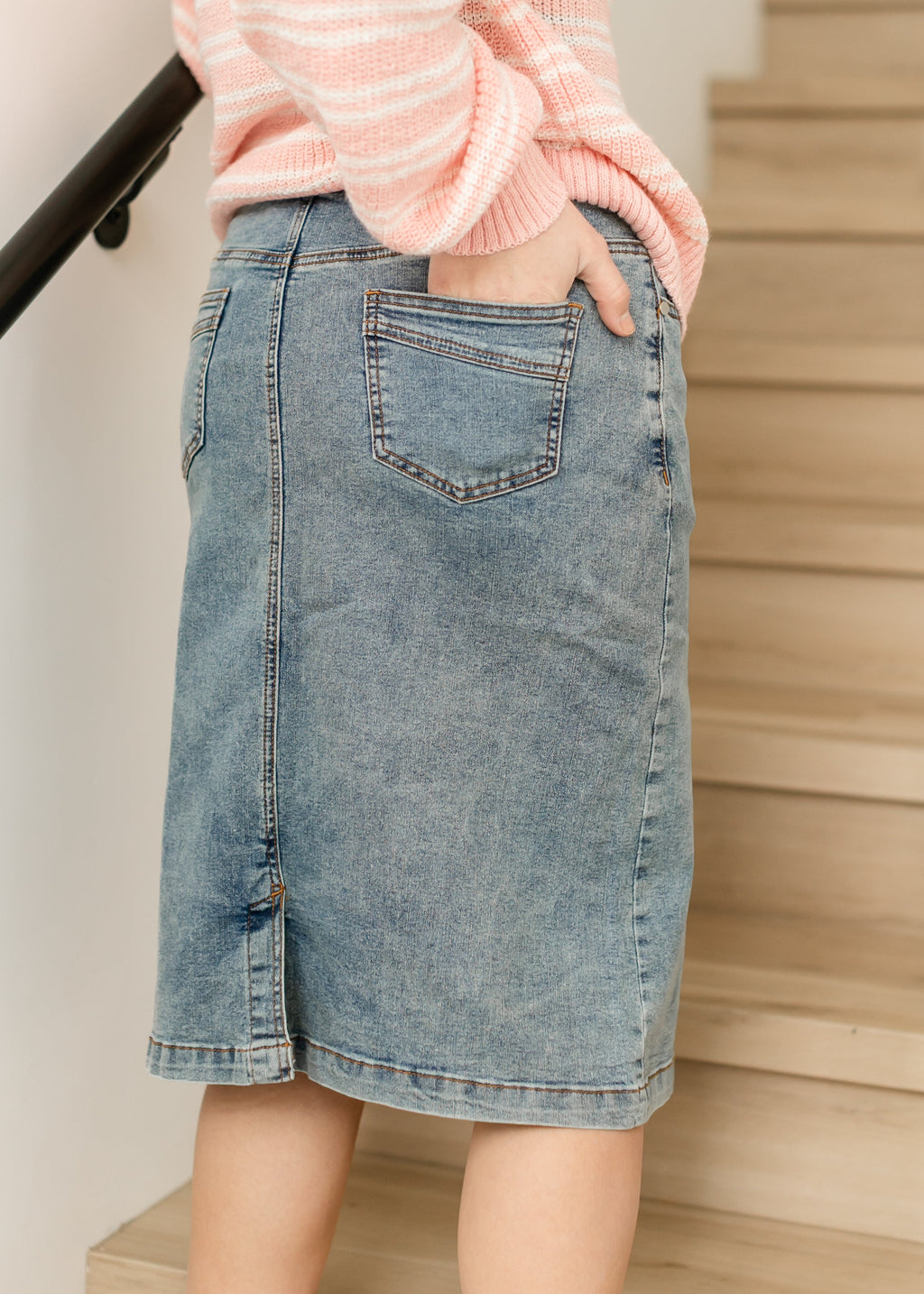 Light blue denim midi skirt with large front patch pocket and side slit