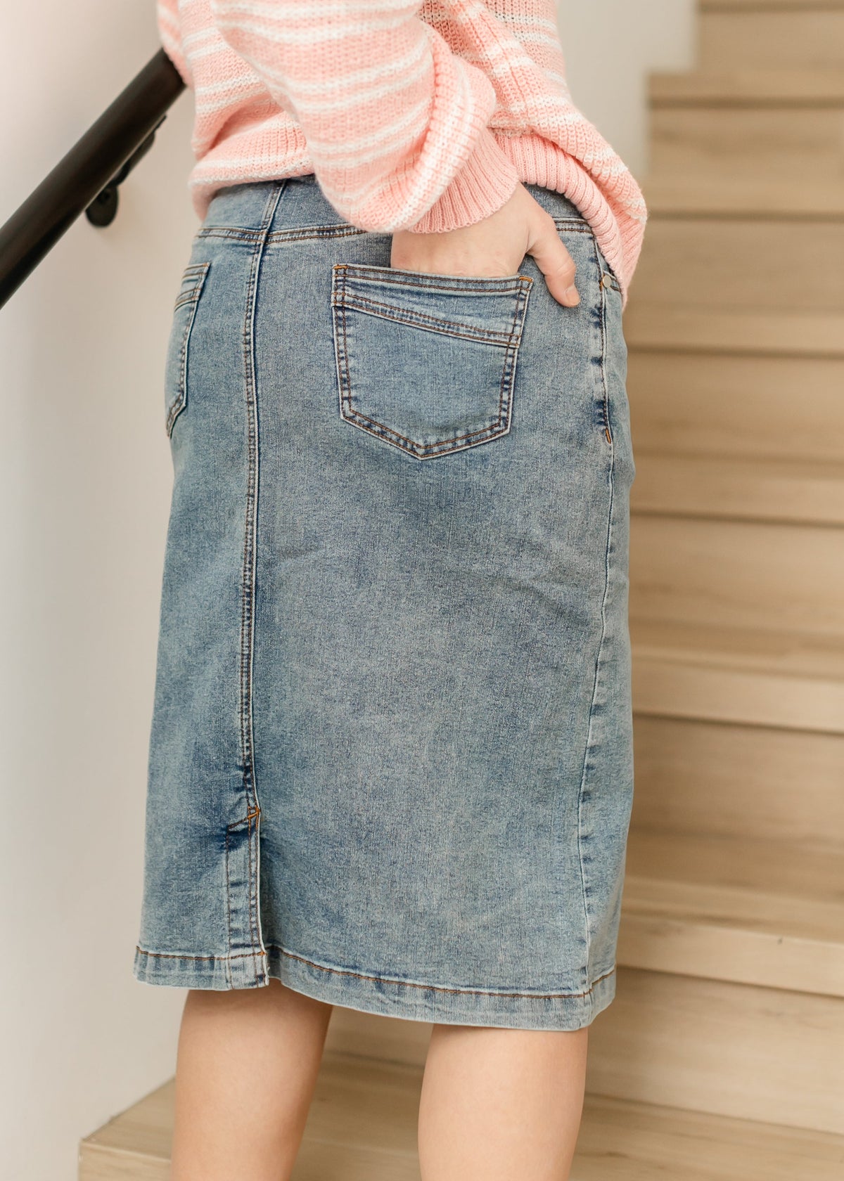 Light blue denim midi skirt with large front patch pocket and side slit