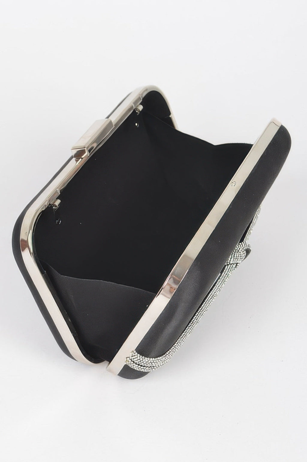Black satin frame clutch open view showing interior and rhinestone chain strap