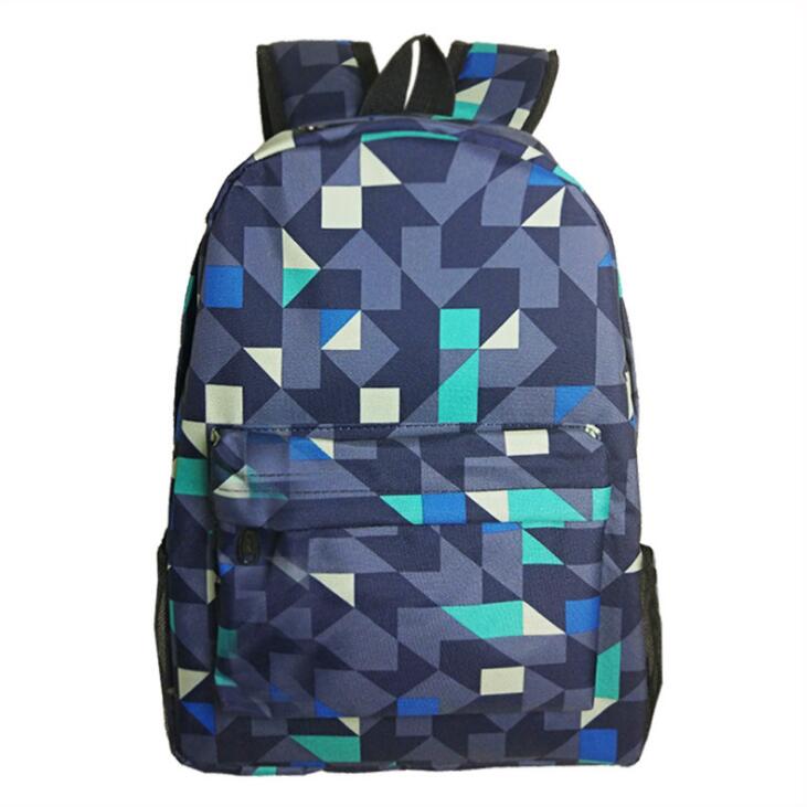 Luminous school backpack with blue geometric pattern, front zip pocket, padded straps
