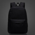 Luminous school backpack in black with front zip pocket, padded straps, top handle