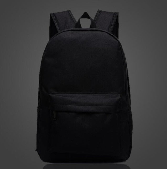 Luminous school backpack in black with front zip pocket, padded straps, top handle