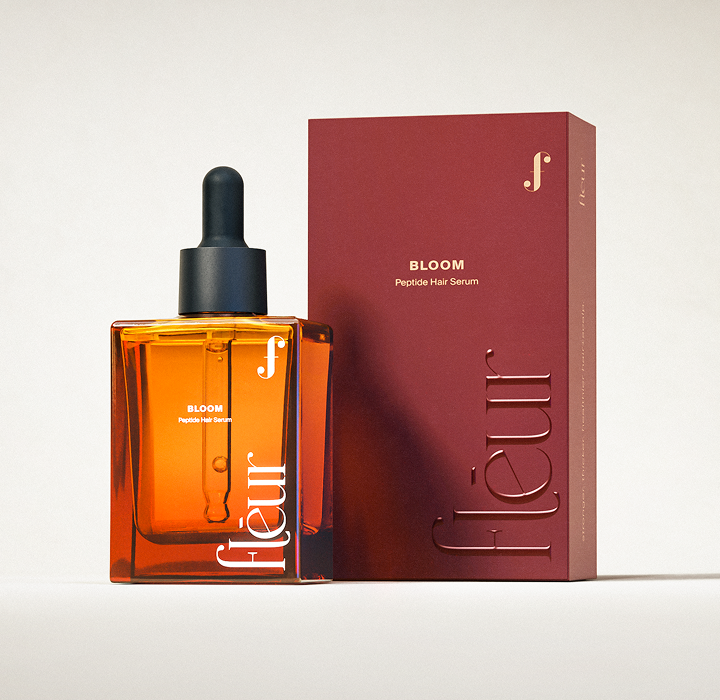 Hair and scalp peptide serum bottle with dropper, dark amber bottle and black cap