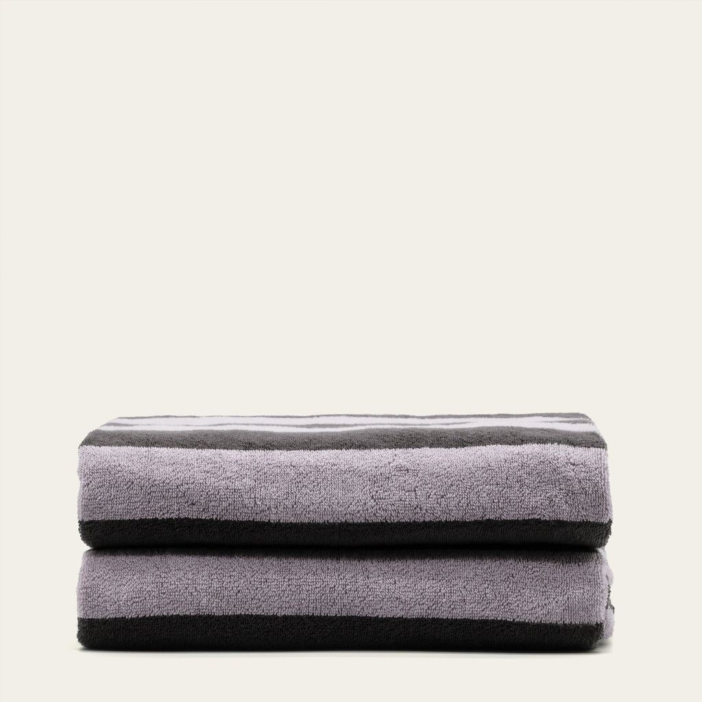 Australian cotton towels, lilac-gray folded bath sheet stack, plush terry cloth