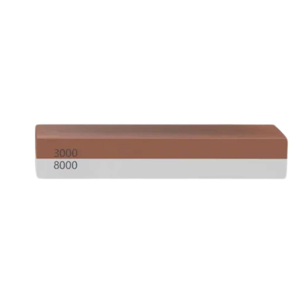 Close-up sharpening stone with 3000 and 8000 grit labels